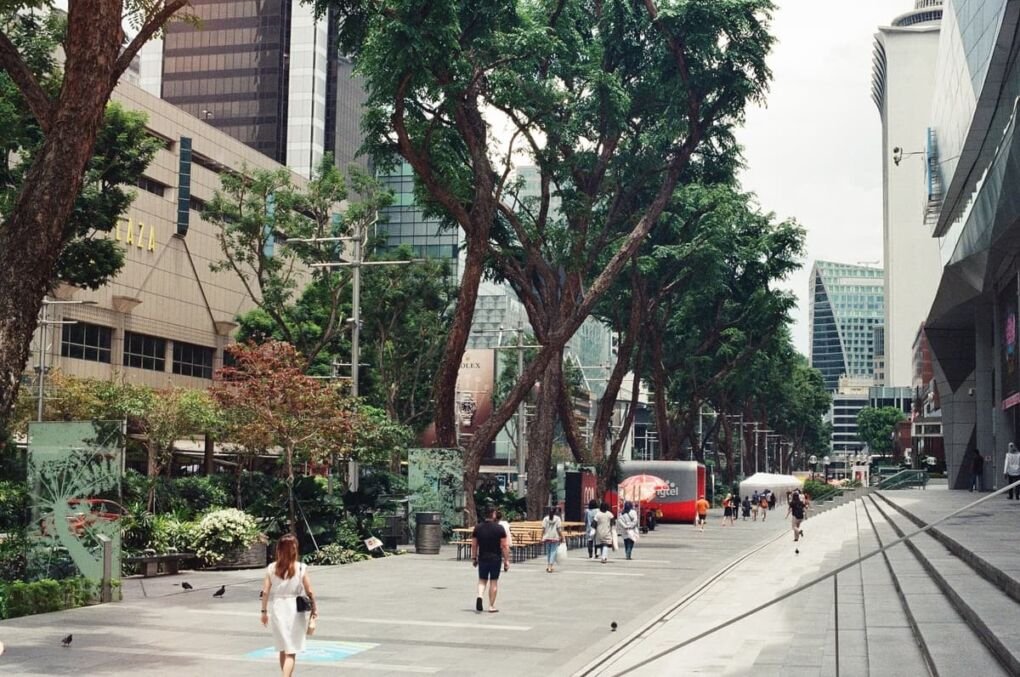 People walking in Orchard Road, one of Singapore's most expensive places to live.