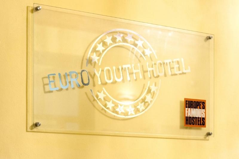 Euro Youth Hostel name on glass plaque on wall