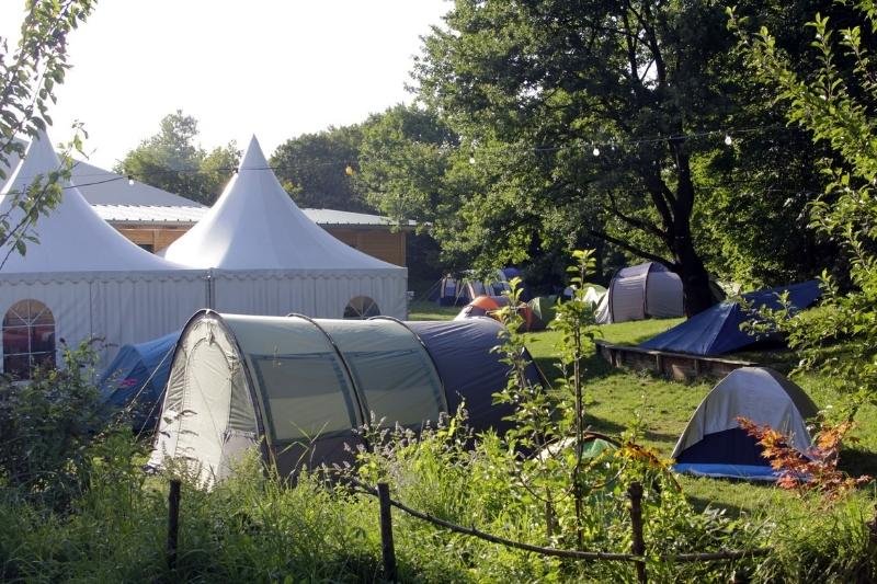 Tents from The Tent Hostel on green lawn in Munich