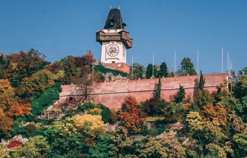 graz-clock-tower-autumn-leaves