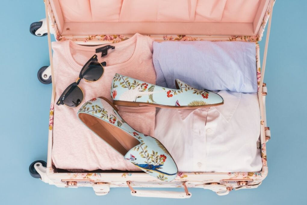pink suitcase packed for travel