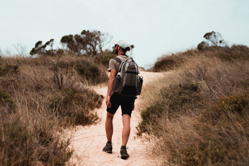 man walking the Robberg traill