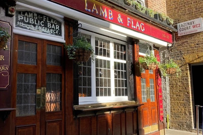 red exterior of Lamb & Flag pub in London