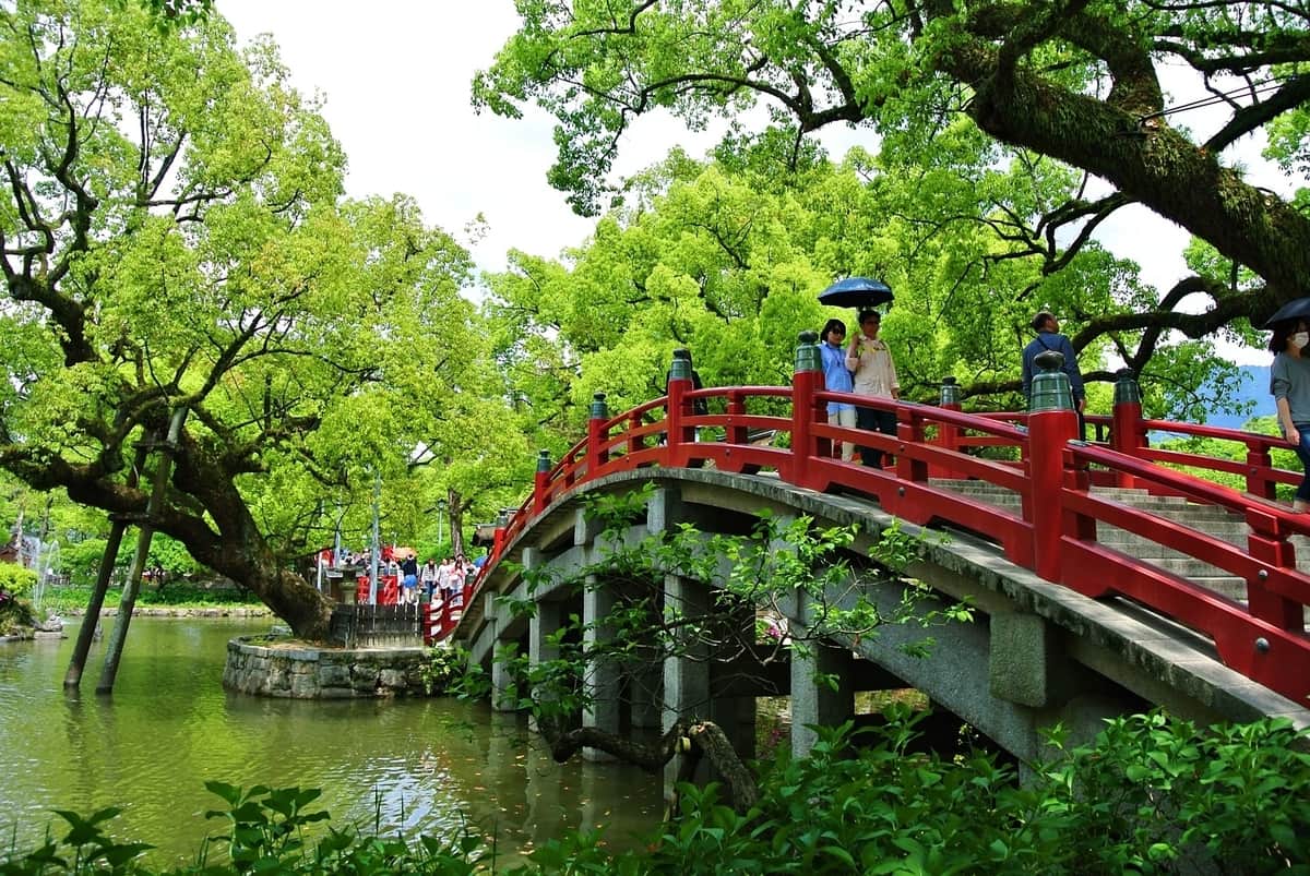 red-bridge-over-a-lake-in-a-garden-in-fukuoka-japan