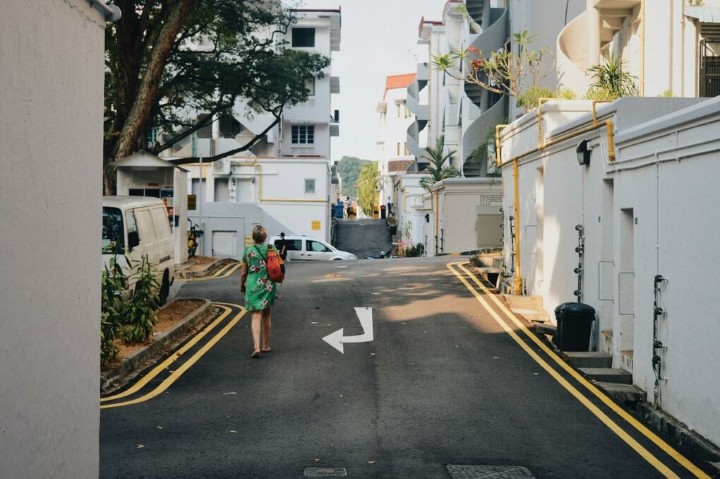 Woman walking along the street in Singapore's Tiong Bahru neighborhood.