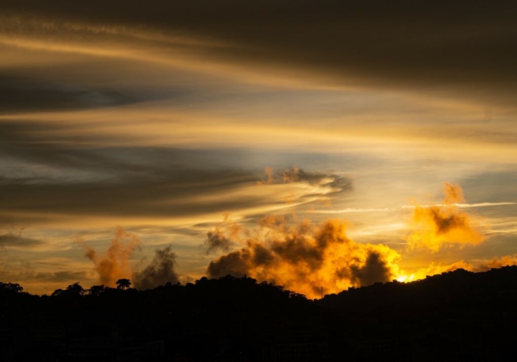 Sunset behind silhouette of mountain in Baguio City