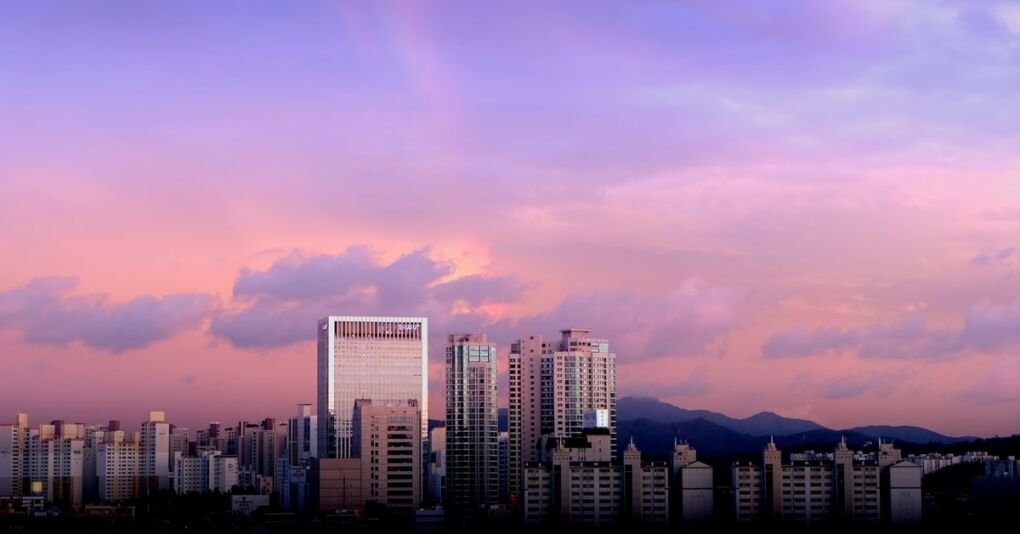 Seoul city skyline with a purple sunset in the background