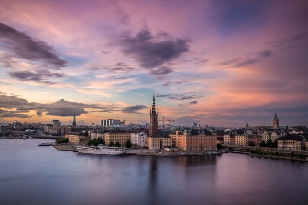 Body of water and city skyline of Stockholm City, Sweden during the evening