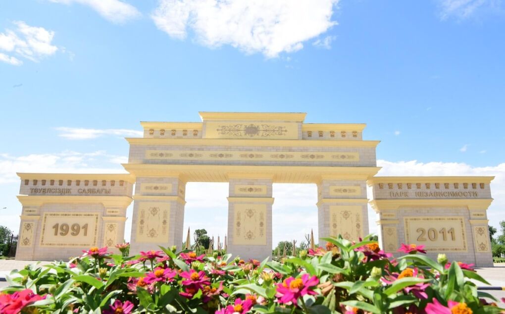 Archway in Shymkent with flowers in front