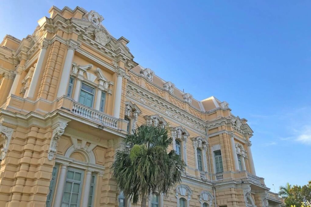 An old, yellow colonial building in Merida. 