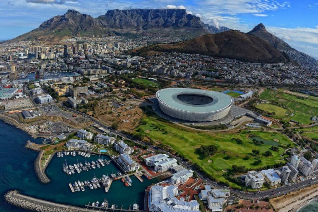 Cape Town with Table Mountain in the background and Green Point Stadium in the foreground.