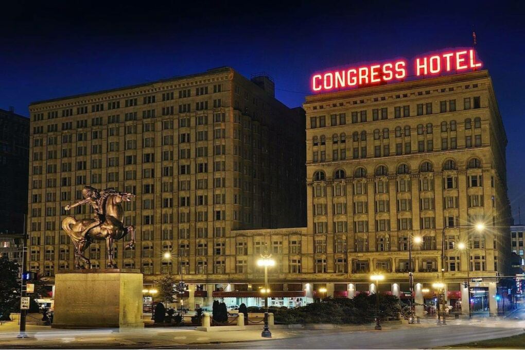 The outside of the Congress Hotel at nighttime.