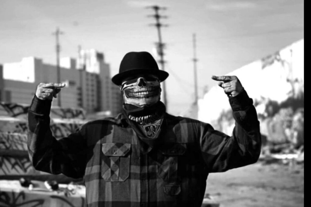 Gangster wearing a skull mask.