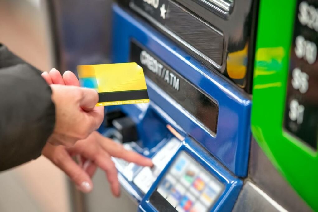 A person using an ATM.