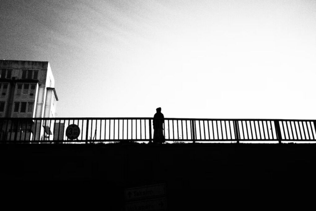 Black_and_white_image_of_person-standing_on_Turkey_bridge