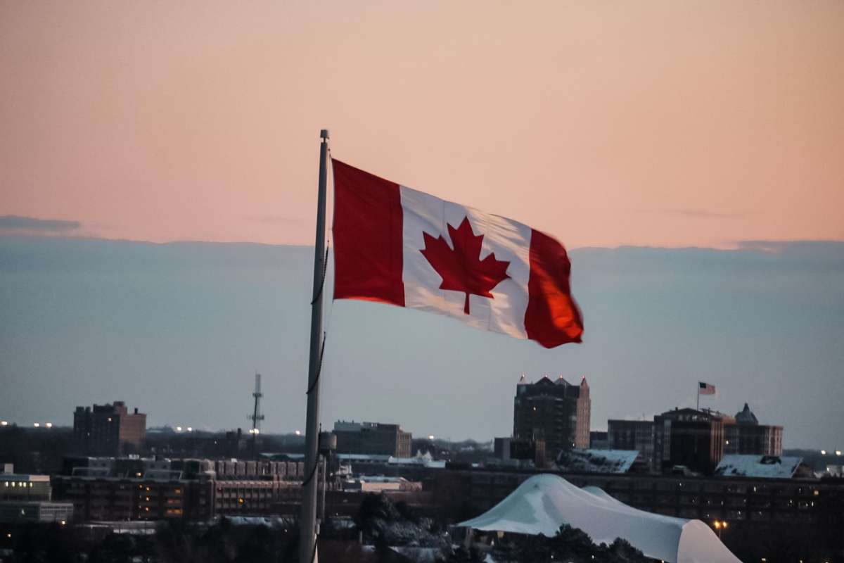 Canadian Flag Against a Sunset Back Drop.