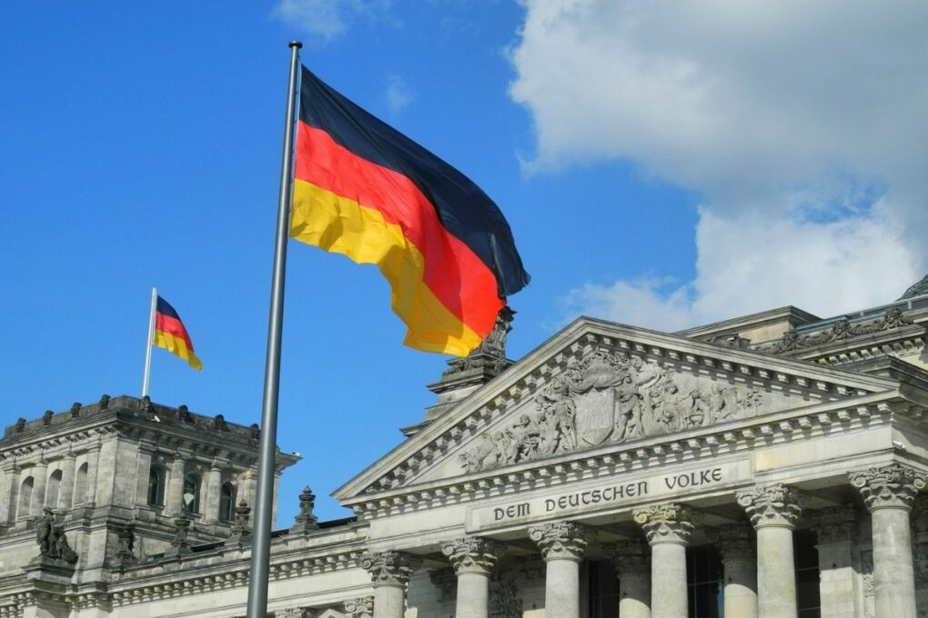 image-of-the-german-flag-next-to-german-parliament