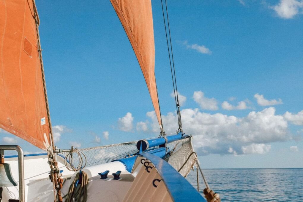 A sail boat on the Milne Bay waters