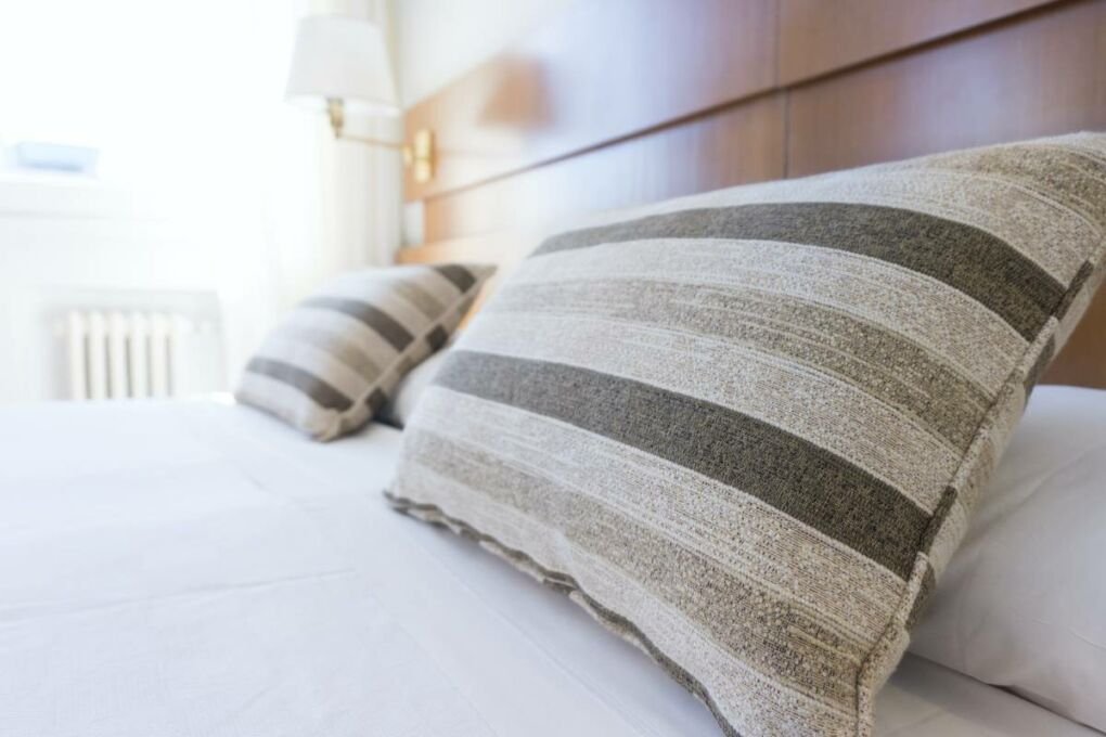 Grey and white hotel room linen