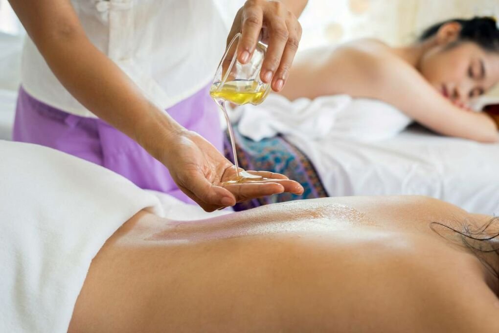 Two women at a spa getting an oil massage