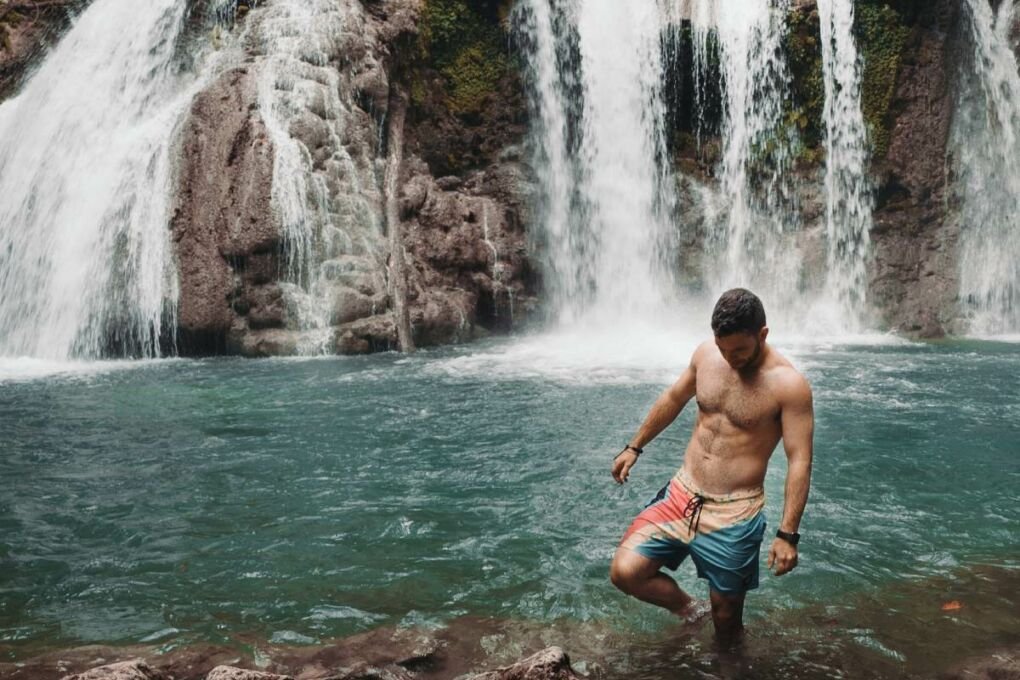 A tourist enjoying the waterfalls in the Dominican Republic