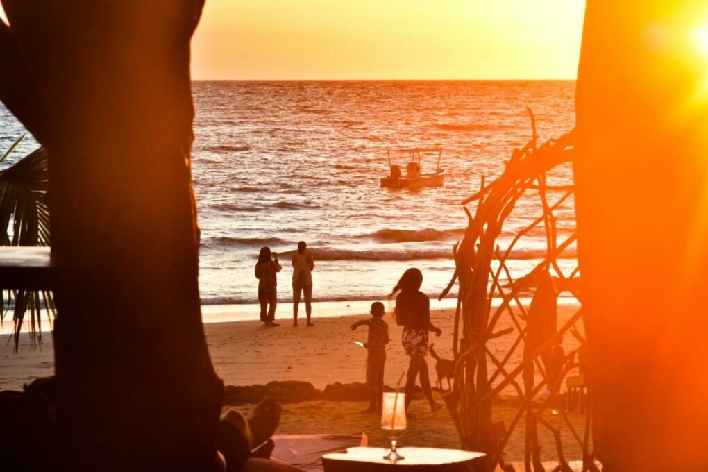 Tourists enjoying the sunset at a Nosey Be beach