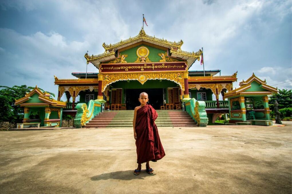 Young boy in front of temple in Myanmar