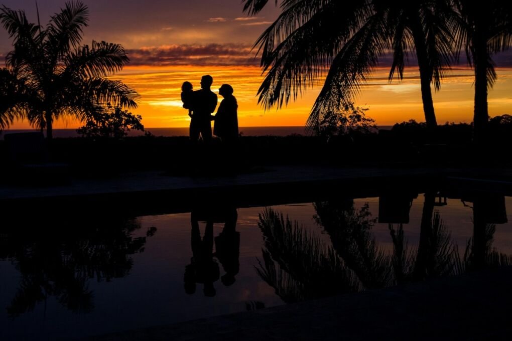 Family admiring the sunset in Kailua Kona