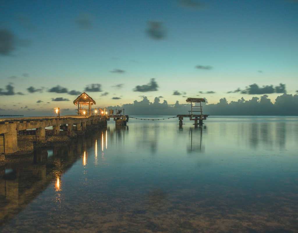 brown-dock-on-the-shore-during-night-time