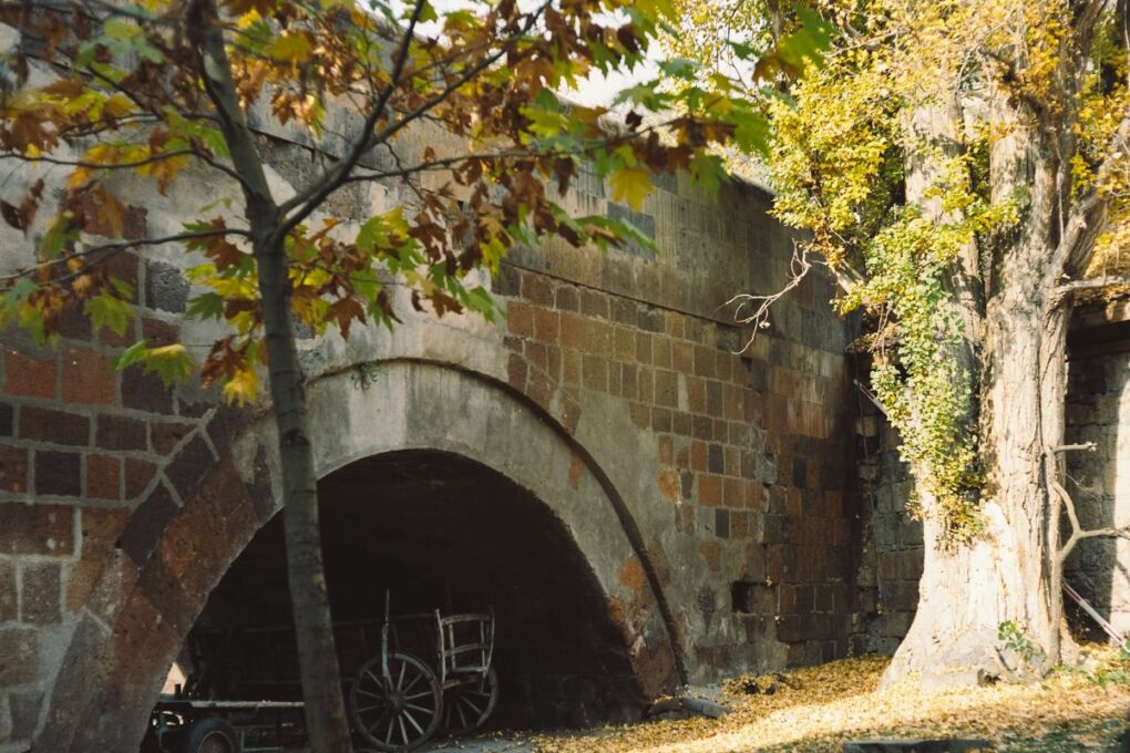 an-old-brick-tunnel-with-a-wagon-in-it