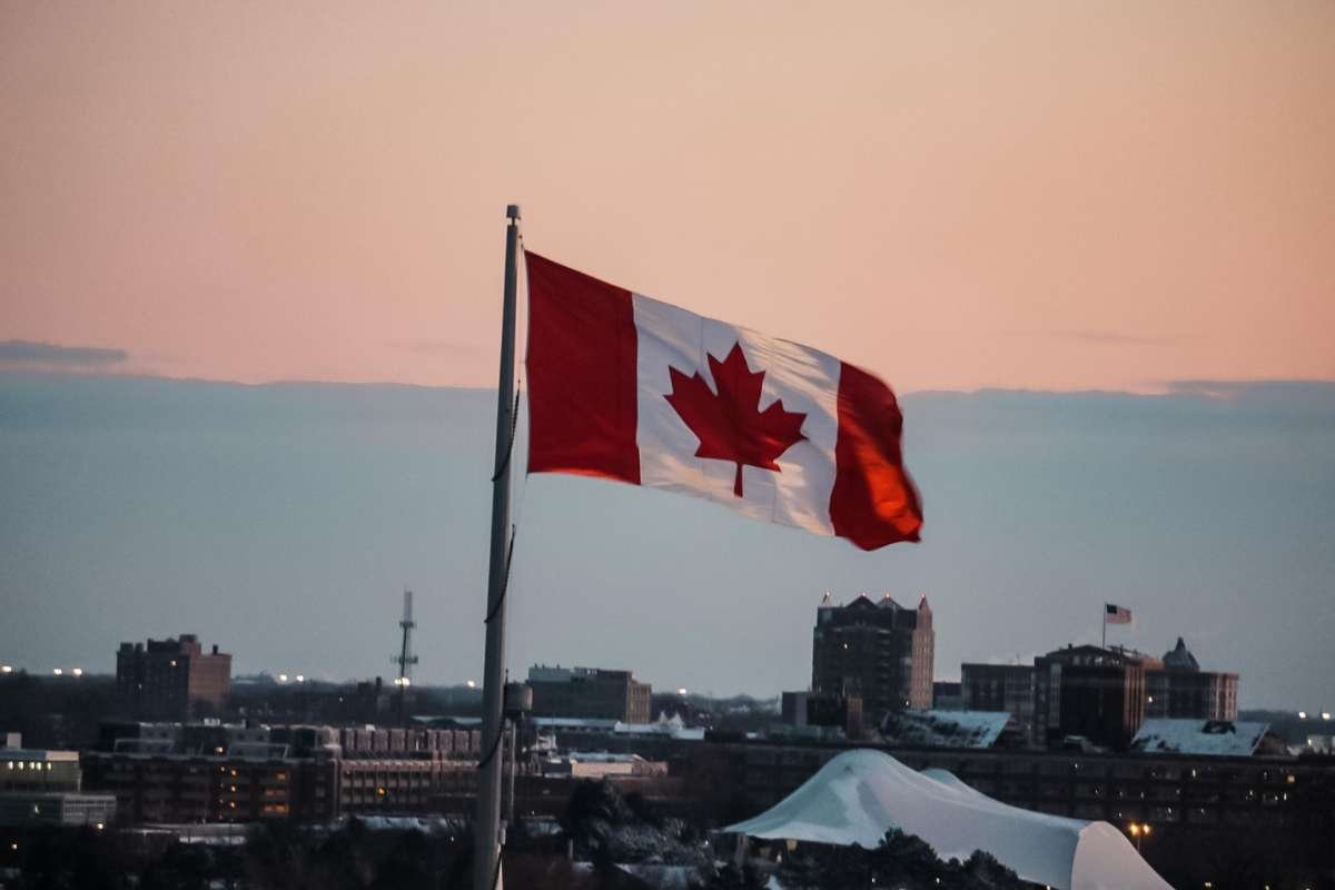 Canadian Flag Against a Sunset Back Drop.|Aerial Photo of Toronto During Golden Hour.|Aerial Photo of Winnipeg.|Fairmont Le Chateau Frontenac in Quebec.|Lake Louise in Canada.|Moraine Lake in Canada.|Photo of a Wildfire.|Plate of Poutine.|Snowstorm in Montreal.|Snowy Night in Quebec.|Woman Wearing a Balaclava