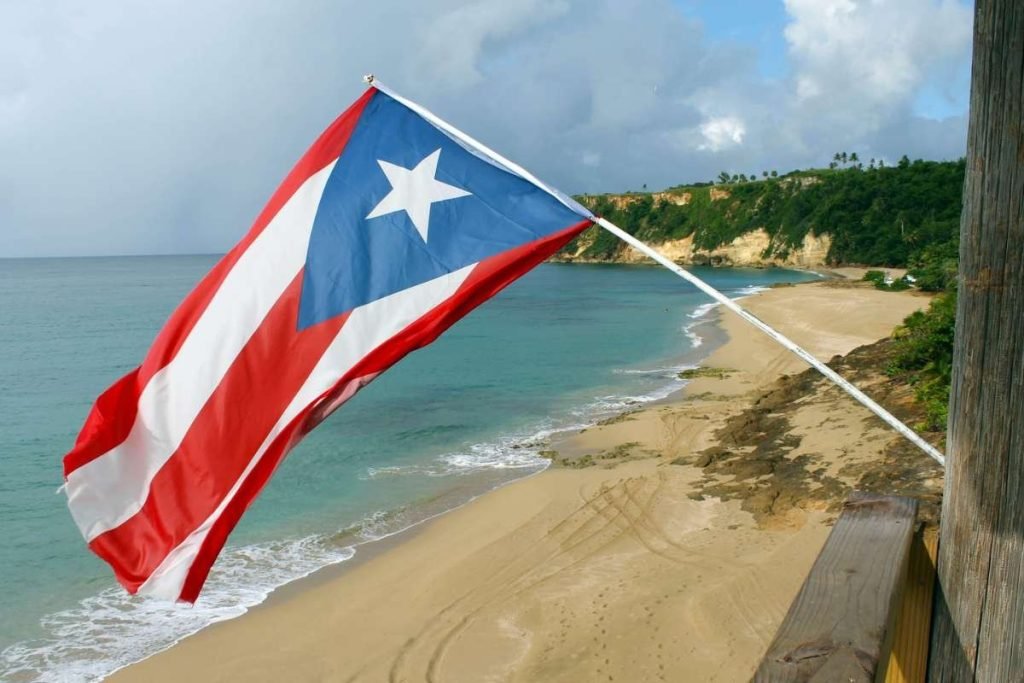 Puerto Rican Flag Hanging Over a Beach.|Castillo San Cristobal in Puerto Rico.|Lighthouse in Puerto Rico.|Old San Juan in Puerto Rico.|Street Art in San Juan Puerto Rico.|Swimming Poll at Museo Castillo Serralles.|Waterfall in Puerto Rico.