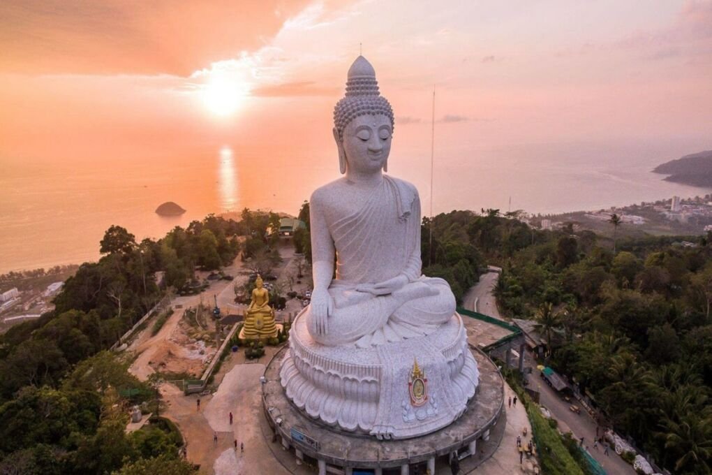 big buddha statue in phuket|boat on phuket beach with island|night market in phuket with woman|phang nga bay with island|phuket town old colonial buildings|pool in phuket|resort in phuket white building|beach with umbrellas|night life in phuket|patong street