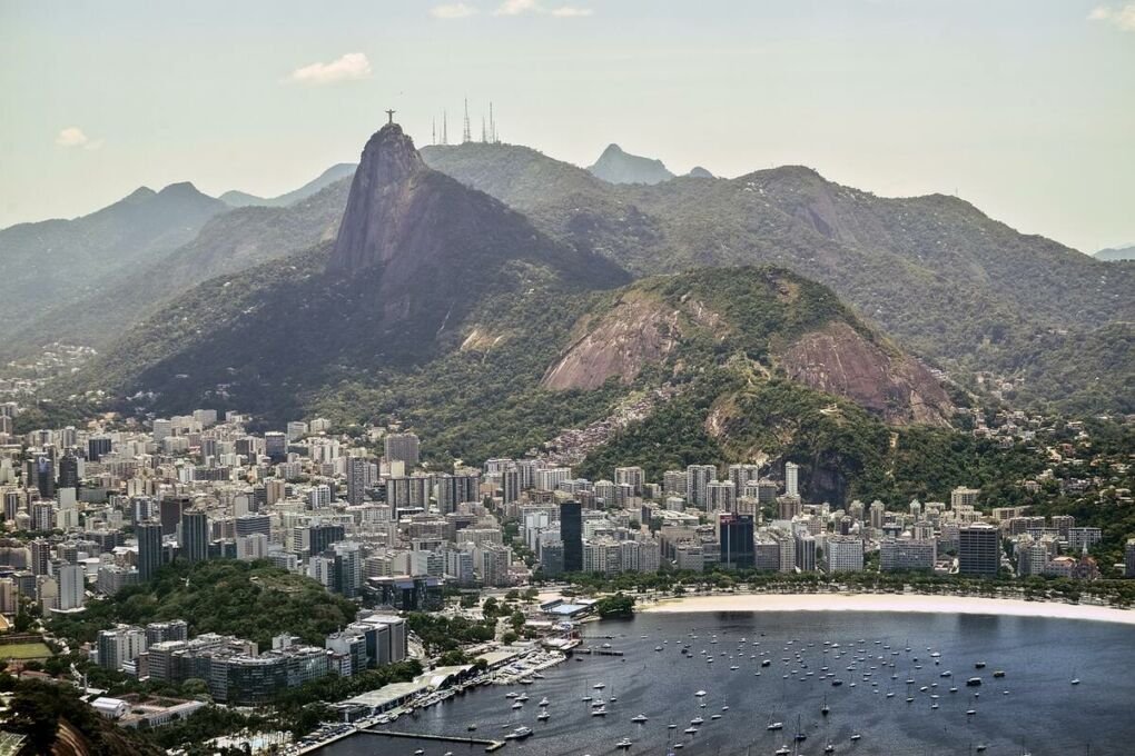 Aerial view of Rio de Janeiro, Brazil|Bar at Beach Life Port de Galinhas|Backyard views of Che Lagarto in Paraty|Exterior view of Galeria 13 Hostel|Mango Tree Hostel outdoor terrace|Common lounge in O de Casa Hostel|Radisson Vila Olimpia outdoor pool and hot tub|Exterior view of Selena Madelena Sao Paulo|Exterior views of Selina Foz|On site restaurant at Selina Lapa Rio de Janeiro|Backyard view of the Search House with pool