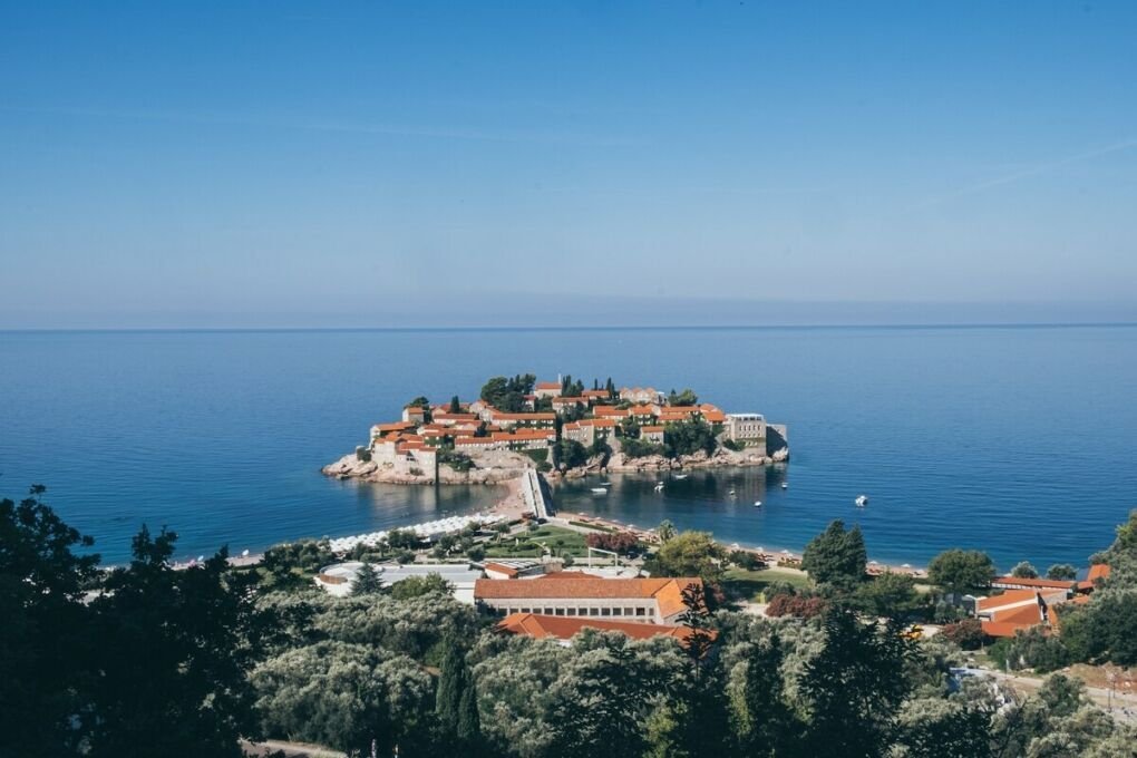 Sveti Stefan island Montenegro|Dobrota Montenegro sea boat mountain|Herceg Novi mountain coastline|Kolasin Montenegro mountains|Kotor Montenegro mountain beside sea|Perast Montenegro ocean view taken from land|Podgorica Montenegro wooden bridge over river|Tivat harbor boats|Ulcinj Montenegro ocean shoreline|Bar Montenegro rocky beach|Budva Montenegro docked boats