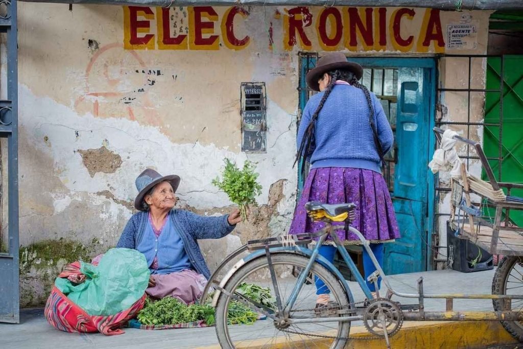 Market-stall-peru|Mountain-in-Peru|mountain-road-in-peru|Alpacas-in-Peru|local-women-on-steps-in-peru|paracas-peru|dancing-women-in-peru|machu-picchu-peru|lima-coast-view-peru|ruins-peru